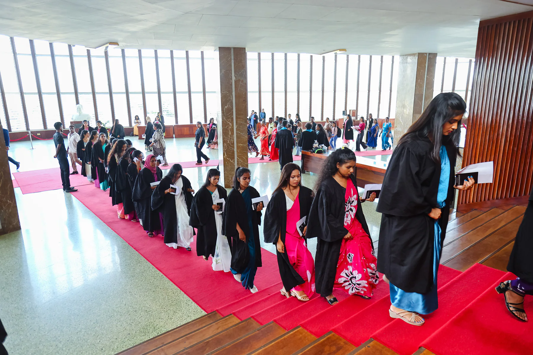 Graduates gathering in procession before entering the convocation ceremony
