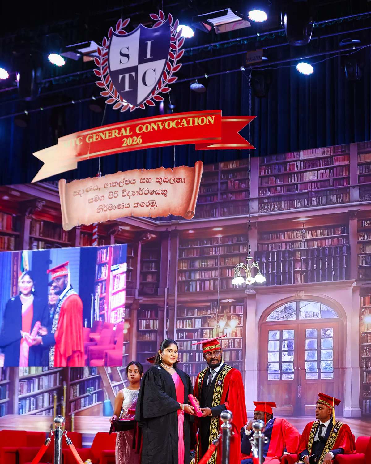 A graduate receiving recognition on the 2026 convocation stage