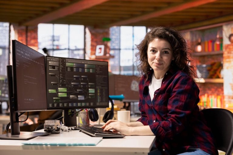 Portrait Smiling Woman Startup Office Coding